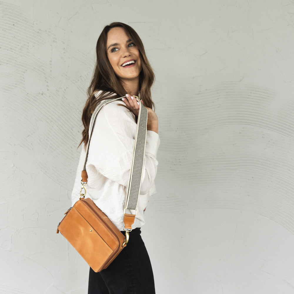 Woman wearing Nomad Crossbody by Elevate with Woven Strap