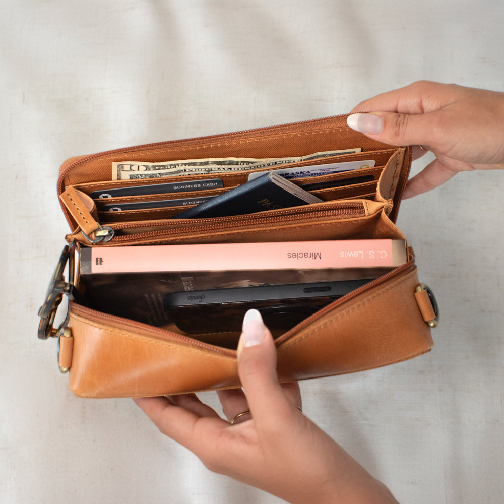 Inside view of Nomad Crossbody by Elevate on linen