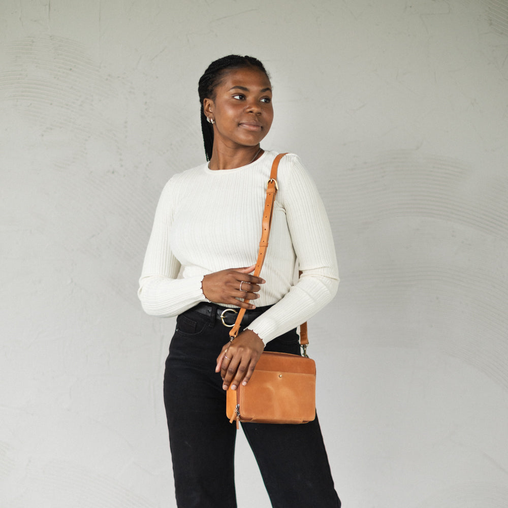 Woman wearing Nomad Crossbody by Elevate